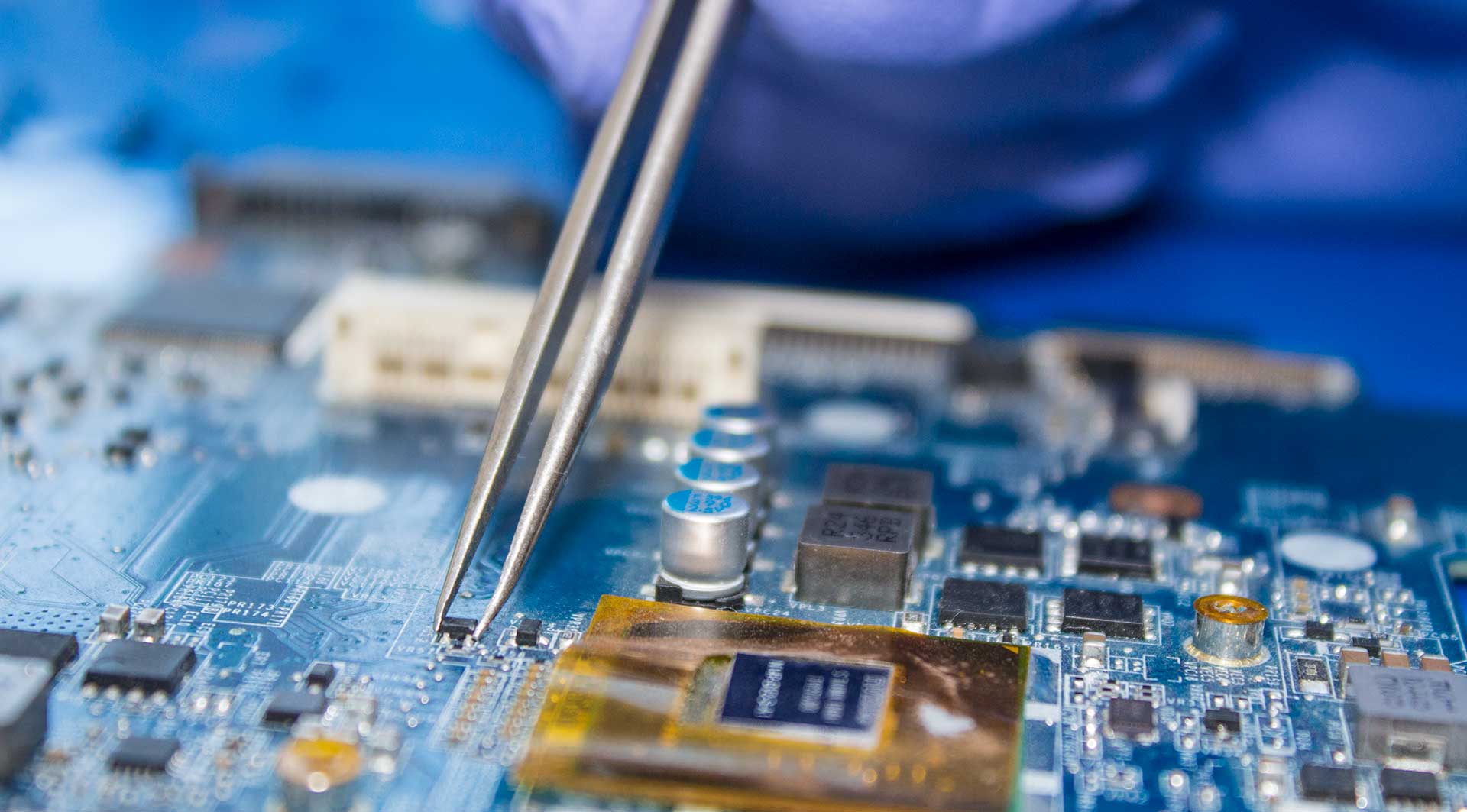 Infotech technician providing video card repair service.
